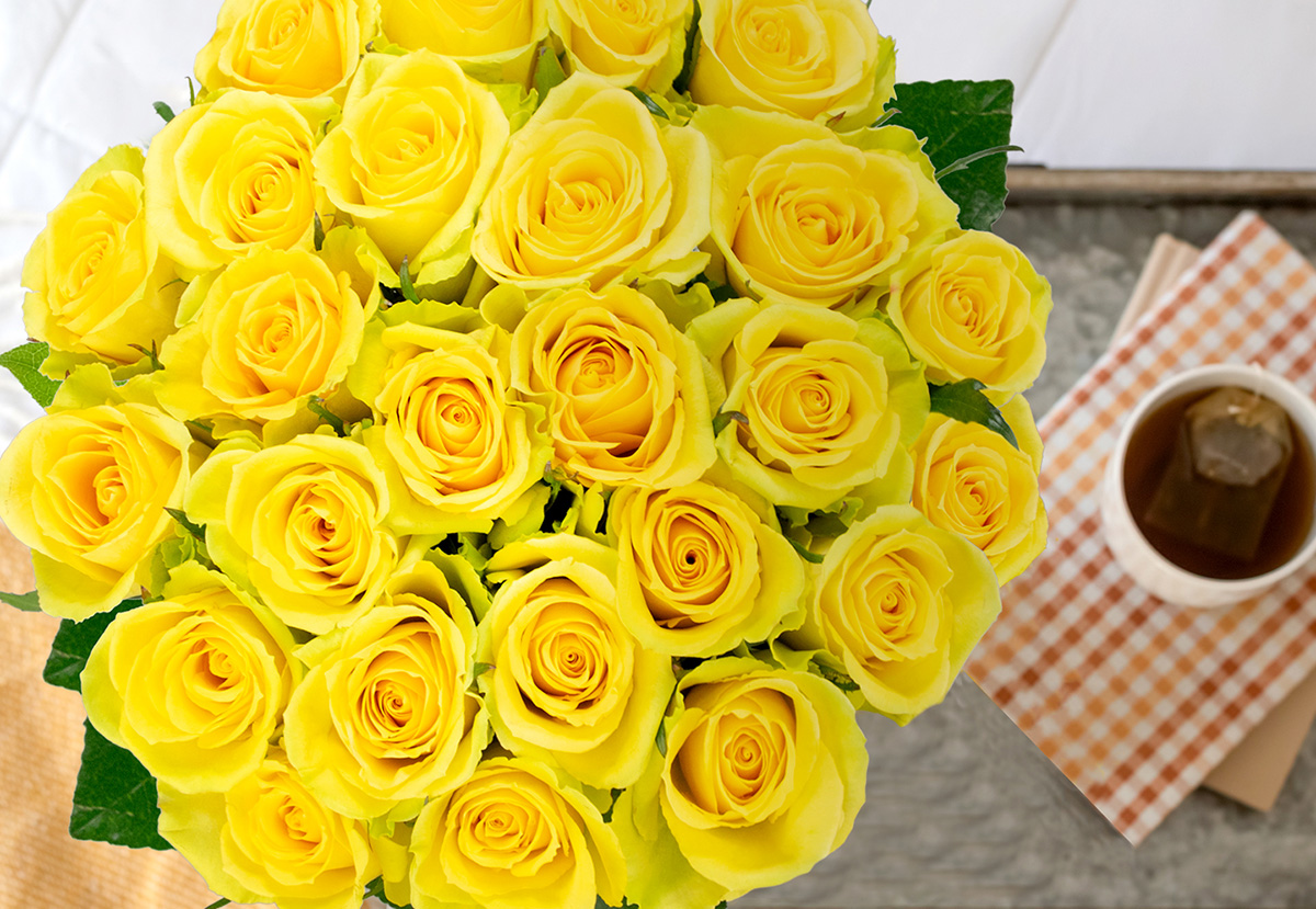 a gift of yellow roses on a tray